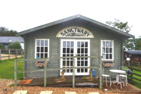 Owls Nest Log Cabin at an Animal Sanctuary